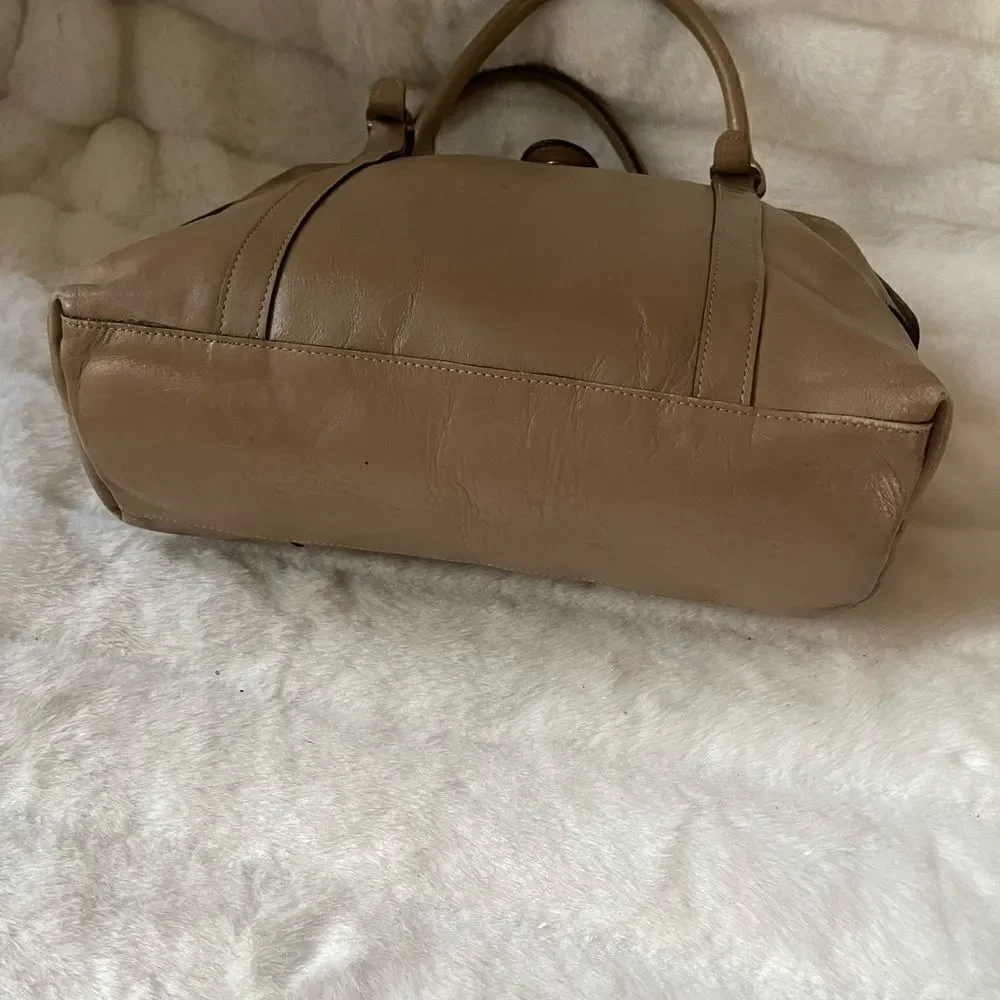 Tano Leather tan frame medium satchel gold tone hardwares .